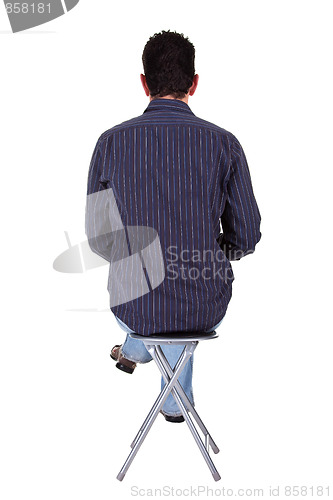 Image of man sitting on a bench in back