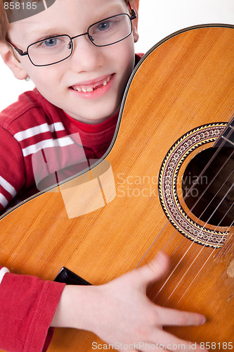 Image of Cute boy with a guitar,