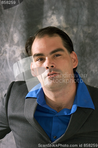 Image of man thinking in suit