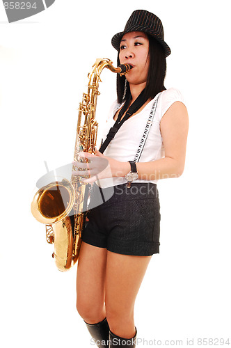Image of Chinese girl playing the saxophone.