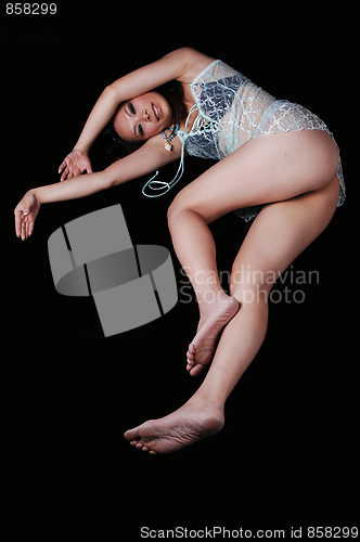 Image of Asian girl lying on the floor.