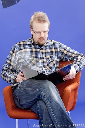 Image of Man reads business papers