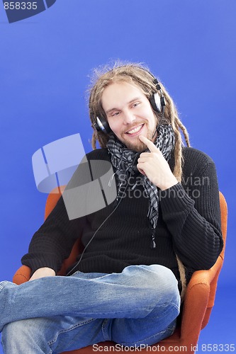 Image of Man listens to music