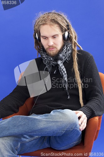 Image of Man listens to music