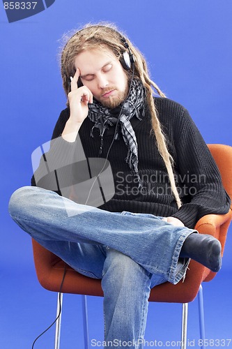 Image of Man listens to music