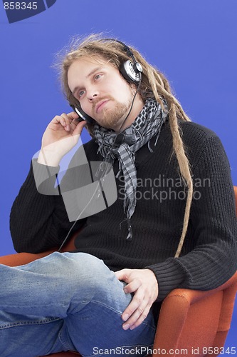 Image of Man listens to music