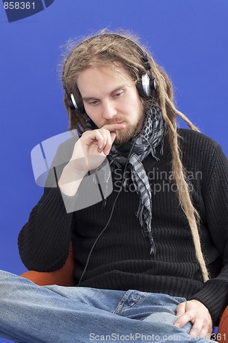 Image of Man listens to music