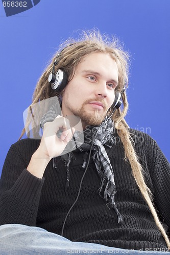 Image of Man listens to music