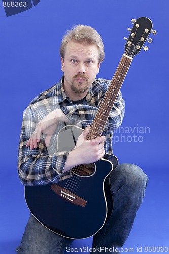 Image of Portrait Of A Man With Guitar