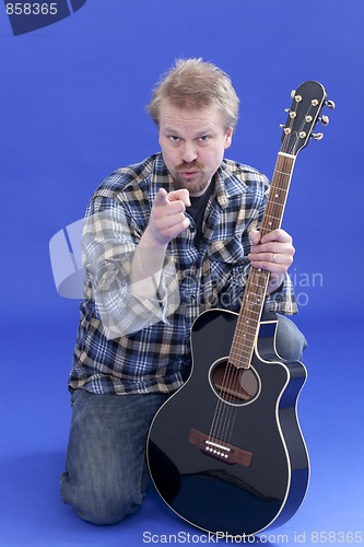 Image of Portrait Of A Man With Guitar