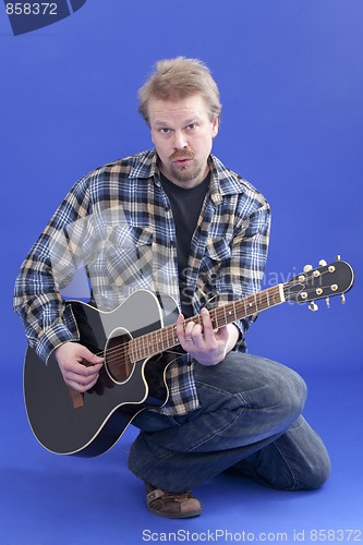 Image of Portrait Of A Man With Guitar