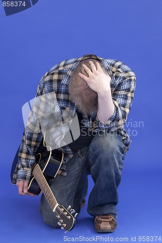 Image of Portrait Of A Tired Guitarist