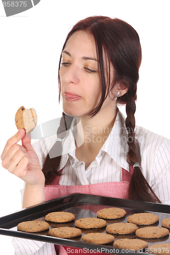 Image of housewife eating a slice of chocolate cake 