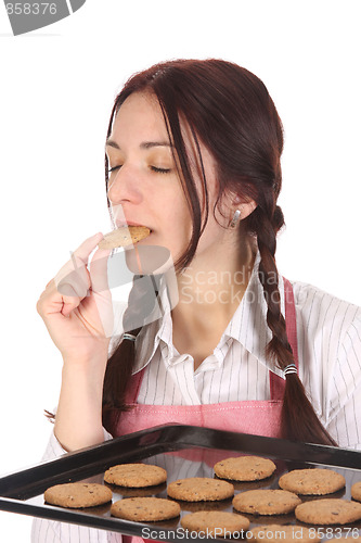 Image of housewife eating a slice of chocolate cake 