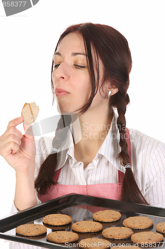 Image of housewife eating a slice of chocolate cake 
