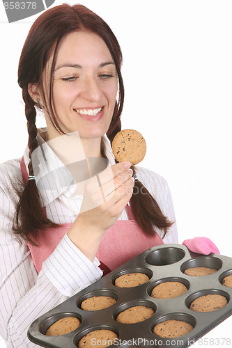 Image of housewife eating a slice of chocolate cake 
