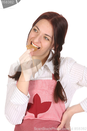 Image of housewife eating a slice of chocolate cake 