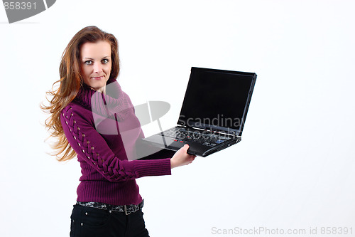 Image of attractive woman shows her Notebook