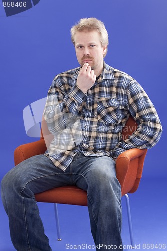 Image of Man Thinking On A Chair