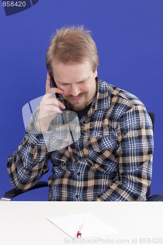 Image of Man Takes A Personal Phone Call