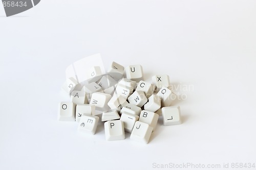 Image of scattered keyboard keys on white 