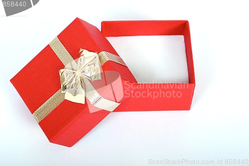 Image of red present box with gold ribbon isolated on white