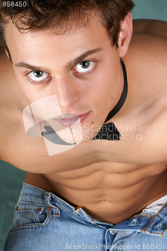Image of Shirtless young man with bow tie
