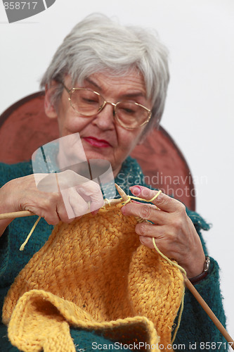 Image of Old woman knitting