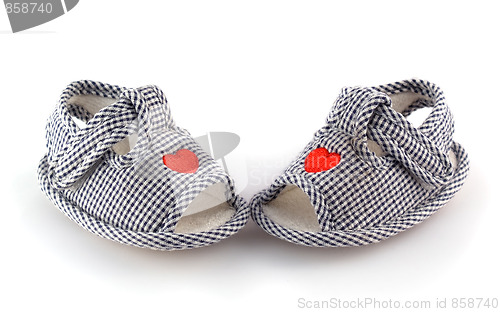 Image of Baby shoes on the white with red hearts