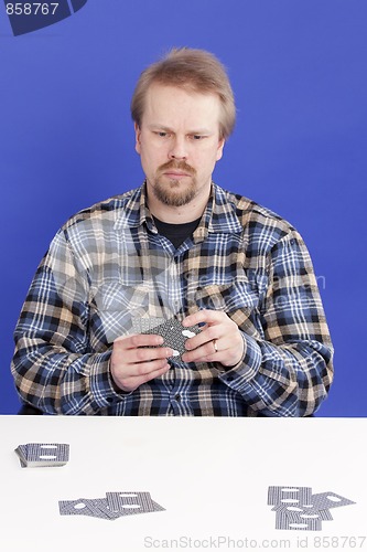 Image of Man Plays Solitaire Card Game