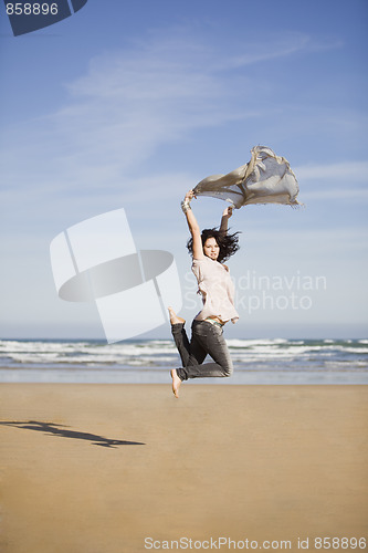 Image of pretty happy girl jumping