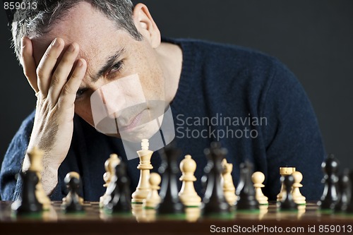 Image of Man at chess board