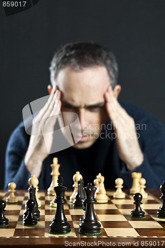 Image of Man at chess board