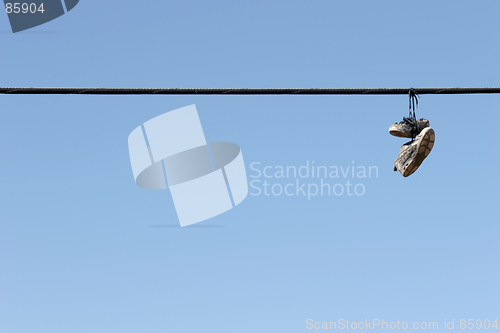 Image of shoes on power lines