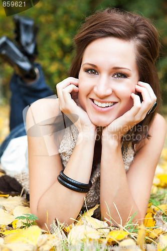 Image of Happy beautiful autumn woman