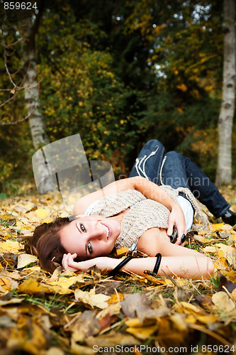 Image of Happy beautiful autumn woman