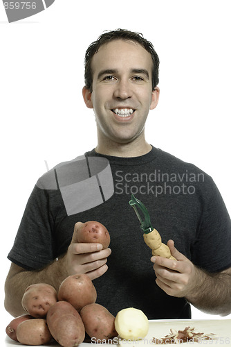 Image of Man Peeling Potatoes