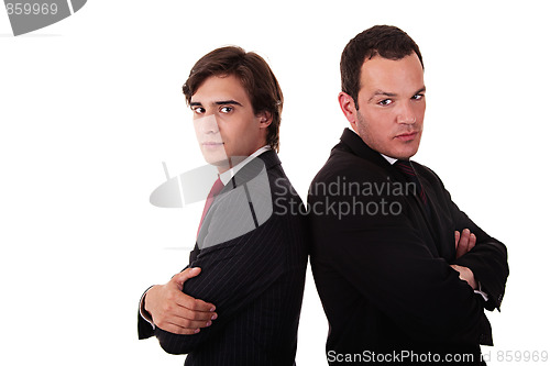 Image of two businessman standing back to back