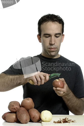 Image of Man Peeling Potatoes