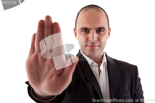 Image of man with his hand raised in signal to stop