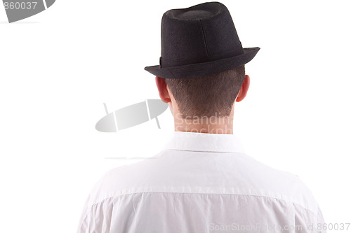 Image of man on his back with a black hat on