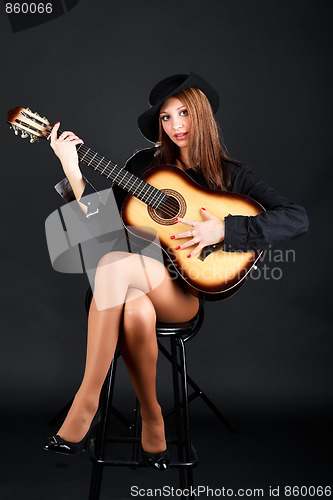 Image of Woman with guitar.