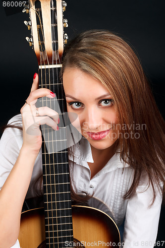 Image of Woman with guitar.