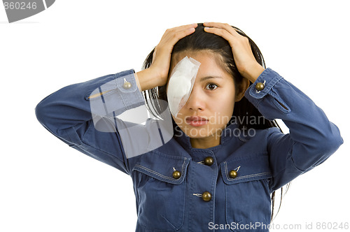 Image of young woman after eye surgery