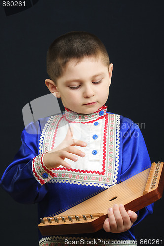 Image of Little boy playing gusli