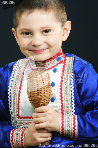 Image of Little boy playing maracas