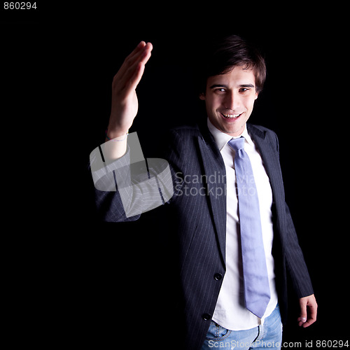 Image of young businessman waving