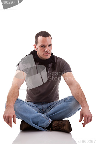 Image of handsome man, sitting on the floor