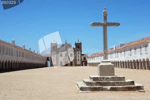 Image of Big cross with church in the background