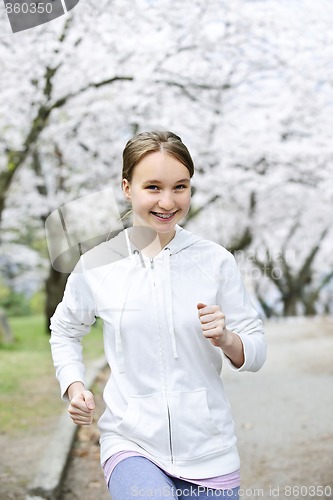 Image of Girl jogging in park